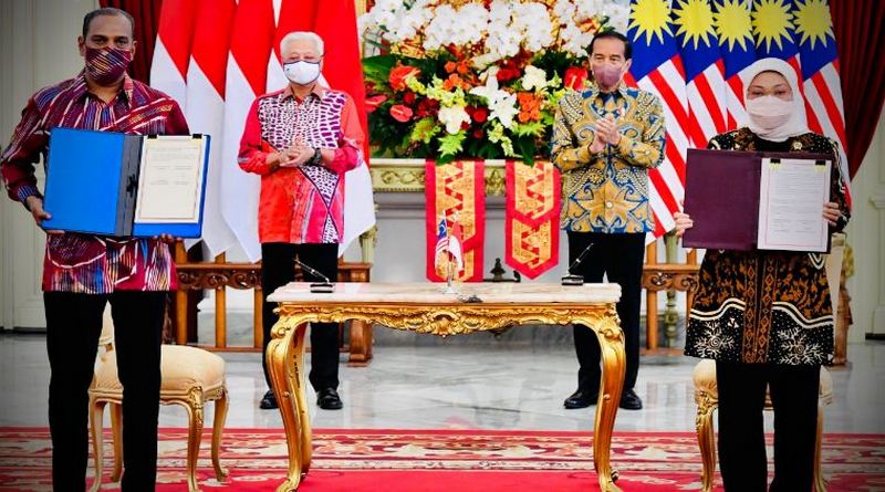 penandatanganan kerja sama indonesia malaysia soal pmi -87yjk